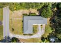 Top-down shot of the house surrounded by mature trees, showing the roof and the layout of the property at 809 N Magnolia St, Summerville, SC 29483