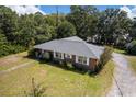Aerial view showcasing the home's architecture and surrounding greenery, highlighting the property's setting at 809 N Magnolia St, Summerville, SC 29483