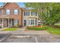 Charming townhome with a bay window, manicured lawn, and convenient parking spaces at 811 Reserve Way, Summerville, SC 29485