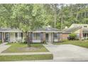 Well-kept single-story home with a brick facade, blue shutters, concrete driveway, and a green lawn at 815 Temple Rd # B, Ladson, SC 29456
