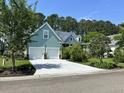 Stylish home with a spacious driveway leading to a convenient two-car garage at 1207 Rivers Reach Dr, Wando, SC 29492