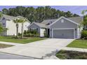 A cozy single-Gathering home is nestled within a peaceful neighborhood with mature trees and beautiful landscaping at 1245 Hammrick Ln, Johns Island, SC 29455