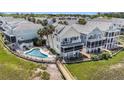 Aerial view of beach home with a private pool, boardwalk, and ocean view at 126 W 2Nd St, Folly Beach, SC 29439
