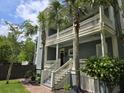 Inviting home showcasing dual porches, stately columns, and lush landscaping at 133 Wando Reach Rd, Wando, SC 29492