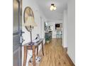 Inviting entryway with hardwood floors, stylish decor, and a view of the open-concept living space at 157 Tyger St, Summerville, SC 29485
