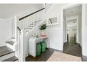 Elegant foyer featuring a staircase, stylish decor, and warm, inviting ambiance, creating a sophisticated entrance at 1872 Rifle Range Rd, Mount Pleasant, SC 29464
