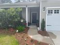 The front porch offers charming curb appeal with a landscaped walkway and inviting entrance at 2022 Elvington Rd, Johns Island, SC 29455