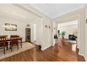 Inviting dining room with wood floors, neutral walls, and a seamless transition into the adjacent living area at 2132 Summerwood Dr, Mount Pleasant, SC 29466