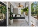 Inviting front porch featuring a swing, fan, and stylish decorations at 2225 Black Oak Court, Mount Pleasant, SC 29466