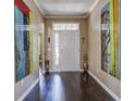 Welcoming entryway with hardwood floors and decorative artwork on the walls at 234 Basket Grass Ln, Summerville, SC 29486