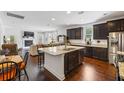 Open-concept kitchen with a large island, stainless steel appliances, and dark cabinetry at 3121 Harding Ct, Johns Island, SC 29455