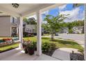 Inviting front porch with a swing and potted flowers, perfect for relaxing and enjoying the neighborhood view at 3121 Harding Ct, Johns Island, SC 29455