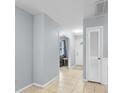 Bright hallway with tiled floor, paneled walls, and access to the living area at 317 Dorchester Manor Blvd, North Charleston, SC 29420