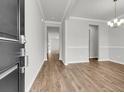 Inviting entryway showcasing beautiful wood flooring, neutral paint, and elegant trim details at 319 Abercom Place Dr, Moncks Corner, SC 29461