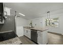 Bright kitchen featuring white cabinetry, a breakfast bar, and stainless steel appliances at 335 Macgregor Dr, Summerville, SC 29486