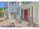 Beautiful townhome featuring a red front door, a garage, and a well-kept front yard at 3367 Eastman Dr, Mount Pleasant, SC 29466
