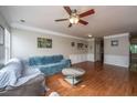 Open concept living room with hardwood floors, neutral walls and lots of charm at 3517 Claremont St, Mount Pleasant, SC 29466