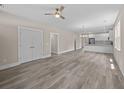 Spacious living room with gray flooring and neutral walls open to the kitchen at 4013 B Ladson Rd, Ladson, SC 29456