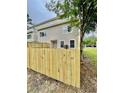 Fenced backyard showcasing the home's exterior and a neatly maintained outdoor space at 4114 Babbitt St, Charleston, SC 29414