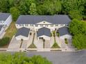 An aerial view shows the community homes with attached garages and shared green spaces at 4591 Great Oak Dr, North Charleston, SC 29418