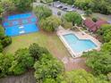 Aerial view of the pool, basketball, and tennis courts in a beautifully landscaped community at 4591 Great Oak Dr, North Charleston, SC 29418
