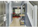 Welcoming foyer boasts tile floors, a decorative table, and access to the staircase and living room at 522 Tayrn Dr, Wando, SC 29492