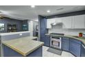 Modern kitchen with concrete countertops, stainless steel appliances, and two-tone cabinetry at 522 Tayrn Dr, Wando, SC 29492