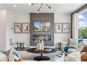 Stylish living room with fireplace, modern lighting, and contemporary decor at 566 Scholar Way, Summerville, SC 29486