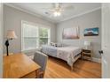 Comfortable bedroom with a light color scheme and wood floors at 626 Windermere Blvd # 4D, Charleston, SC 29407