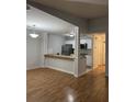 Open concept living room with laminate flooring adjacent to the kitchen at 804 Temple Rd # B, Ladson, SC 29456
