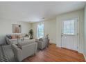 Bright living room with hardwood floors, neutral paint, modern furniture and natural light at 816 Farnham Rd, Charleston, SC 29412