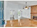Inviting living room showcasing hardwood floors, a cozy fireplace, and an open floor plan at 106 Chaff Ct, Summerville, SC 29485
