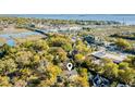 An aerial view showcases the home's proximity to marshlands, the Charleston peninsula, and waterfront, blending nature and city living at 1081 Groves Manor Ct, Mount Pleasant, SC 29464