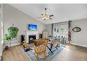 Inviting living room featuring a fireplace, cozy seating, and plenty of natural light and a guitar at 1135 Shoreham Rd, Charleston, SC 29412