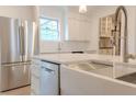 Modern kitchen featuring stainless steel appliances, farmhouse sink, and white cabinets at 117 Lucia St, Charleston, SC 29492