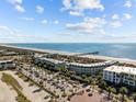 Stunning aerial view of oceanfront condos with private beach access and ample parking at 1300 Ocean Blvd # 308, Isle of Palms, SC 29451