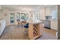 Open concept kitchen with stainless steel appliances, bright lighting and dining area, and outdoor view at 1365 Dunlin Court, Share D, Kiawah Island, SC 29455