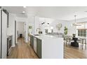 Bright, open kitchen featuring a large island, modern finishes, and hardwood floors at 1366 W Point Dr, Mount Pleasant, SC 29466