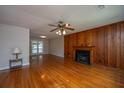 Spacious living room features beautiful hardwood floors and a cozy fireplace at 1707 Sharon Ave, Charleston, SC 29407