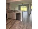 Beautiful kitchen with granite countertops, stainless appliances, and attractive wood-look flooring at 2602 Hidden Gove Dr # 2602, Moncks Corner, SC 29461