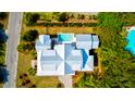 Bird's-eye view of an estate showcasing its unique architectural design, pool, and landscaping at 2870 Ion Ave, Sullivans Island, SC 29482