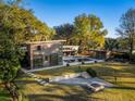 Expansive backyard with a pool, outdoor seating, fire pit and lush lawn for outdoor enjoyment at 317 Seewee Cir, Mount Pleasant, SC 29464