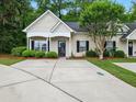 Inviting single-story home featuring a well-kept lawn and a concrete driveway at 325 Dupont Way, Summerville, SC 29485
