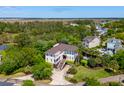 Expansive aerial view showcases the home's setting with mature landscaping, pool, and desirable neighborhood location at 337 Evian Way, Mount Pleasant, SC 29464