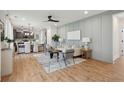 Open concept living room with stylish furniture, wood floors, and view of kitchen at 417 Grove End Rd, Moncks Corner, SC 29461