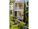 Relaxing outdoor dining area with lush landscaping and elegant porch views at 6 Judith St, Charleston, SC 29403
