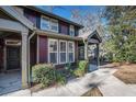 Townhouse with craftsman details, large windows, and covered entrance, situated in a nicely landscaped setting at 8409 Hidden Bakers Trce, North Charleston, SC 29418