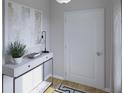 Bright entryway featuring modern decor, a stylish console table, and a white interior door at 105 Moscato Ln, Summerville, SC 29485