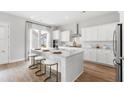 Stylish kitchen with marble island, modern appliances, and counter seating at 122 Moscato Ln, Summerville, SC 29485
