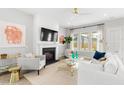 Bright living room featuring fireplace, neutral decor, and plenty of natural light at 122 Moscato Ln, Summerville, SC 29485